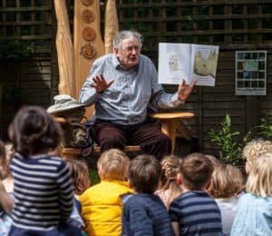Storytime with the storyteller in the garden at the Nursery